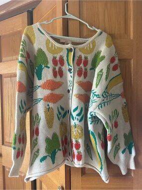 Cottage core cardigan. Oatmeal background with raised knit garden veggies .